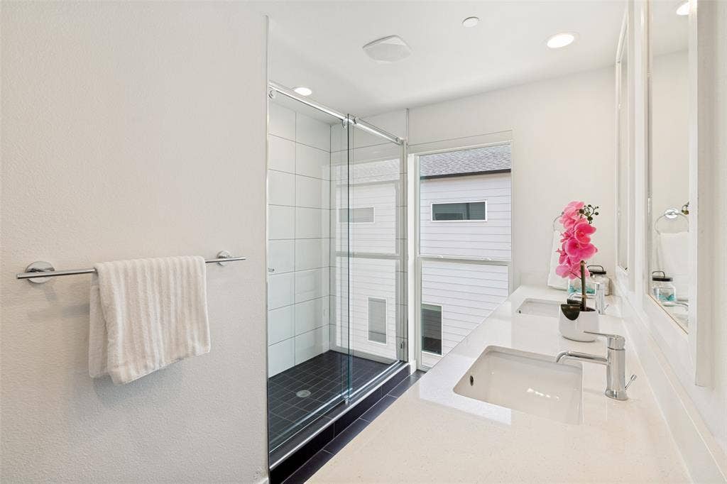 1430 Grigsby Avenue, #104, Dallas, TX 75204 Sleek primary bath. Large walk in shower, Dual sinks