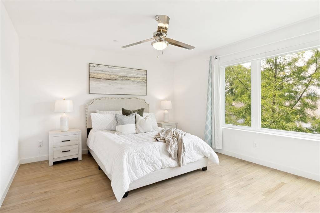 1430 Grigsby Avenue, #104, Dallas, TX 75204 wood floors throughout. Beautiful picture window with tree top views.