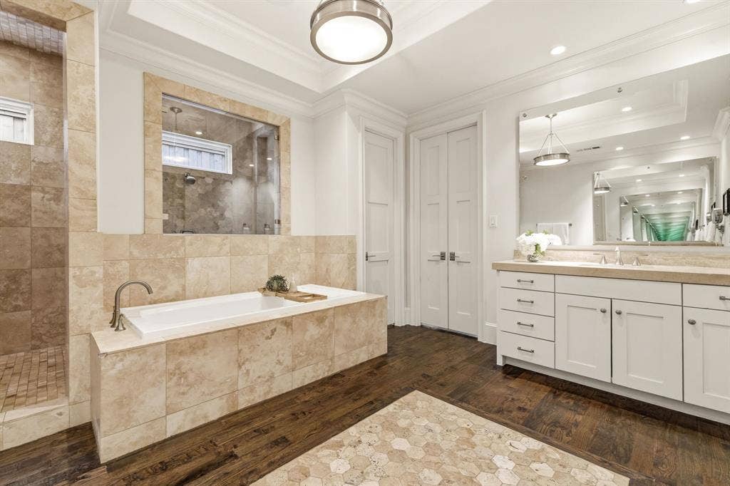 6635 Park Lane, Dallas, TX 75225 Timeless travertine with separate sink areas.