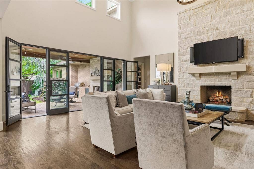 6635 Park Lane, Dallas, TX 75225 Large doors opening to outdoor living space for seamless entertainment.