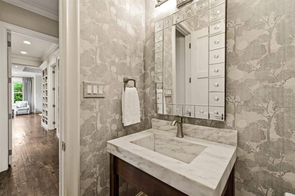 6635 Park Lane, Dallas, TX 75225 Guest bathroom on first floor with designer wall coverings.