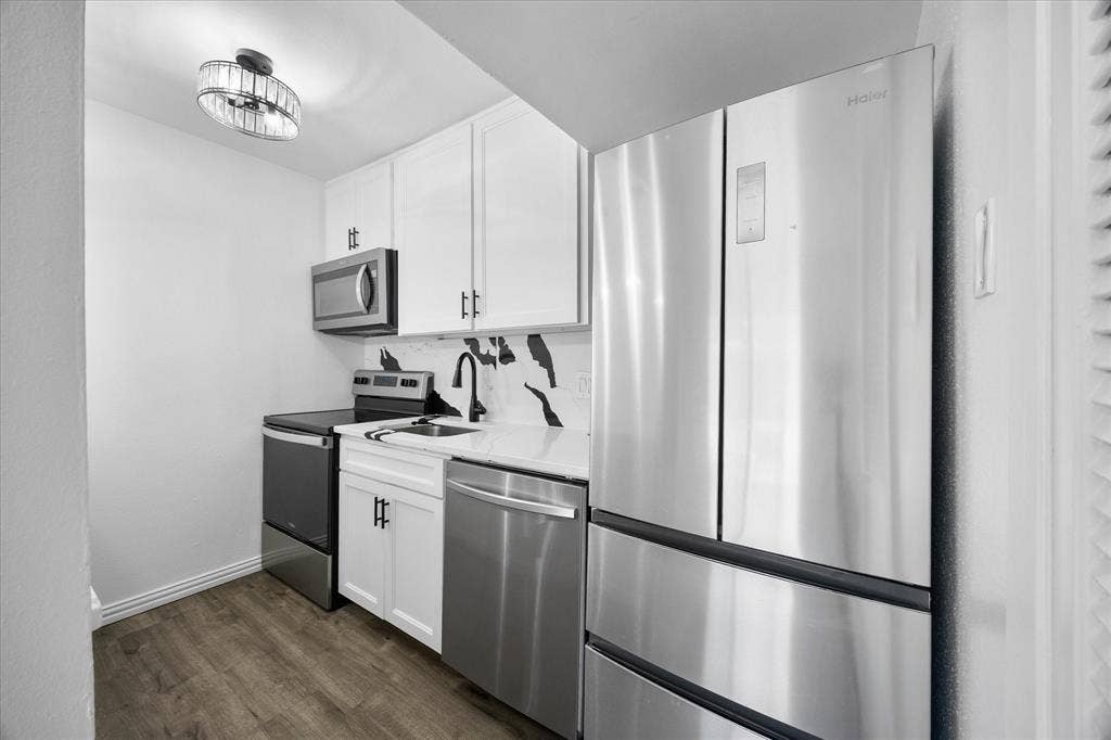 4011 Cole Avenue, #111, Dallas, TX 75204 Updated kitchen with refrigerator included.