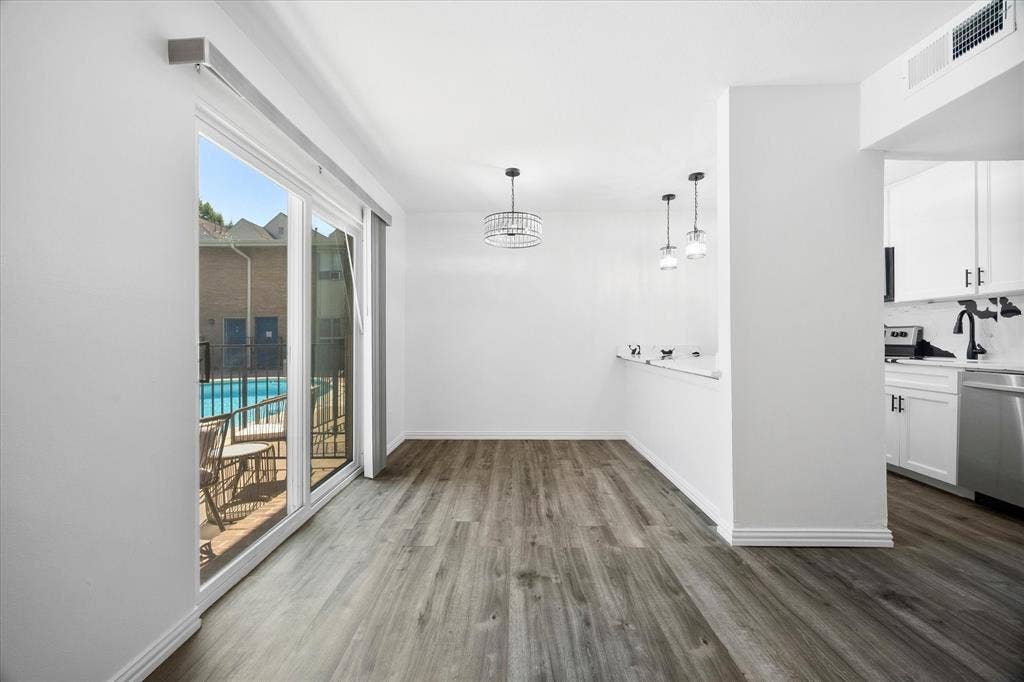 4011 Cole Avenue, #111, Dallas, TX 75204 Original dining area overlooking the community pool and courtyard.