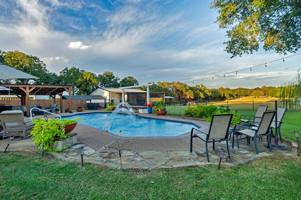 6155 Stephenson Levy Road, Fort Worth, TX 76140 From this view, you can see all of the acreage in the back, & the shop. Under the pegoda is a great hot tub as well.