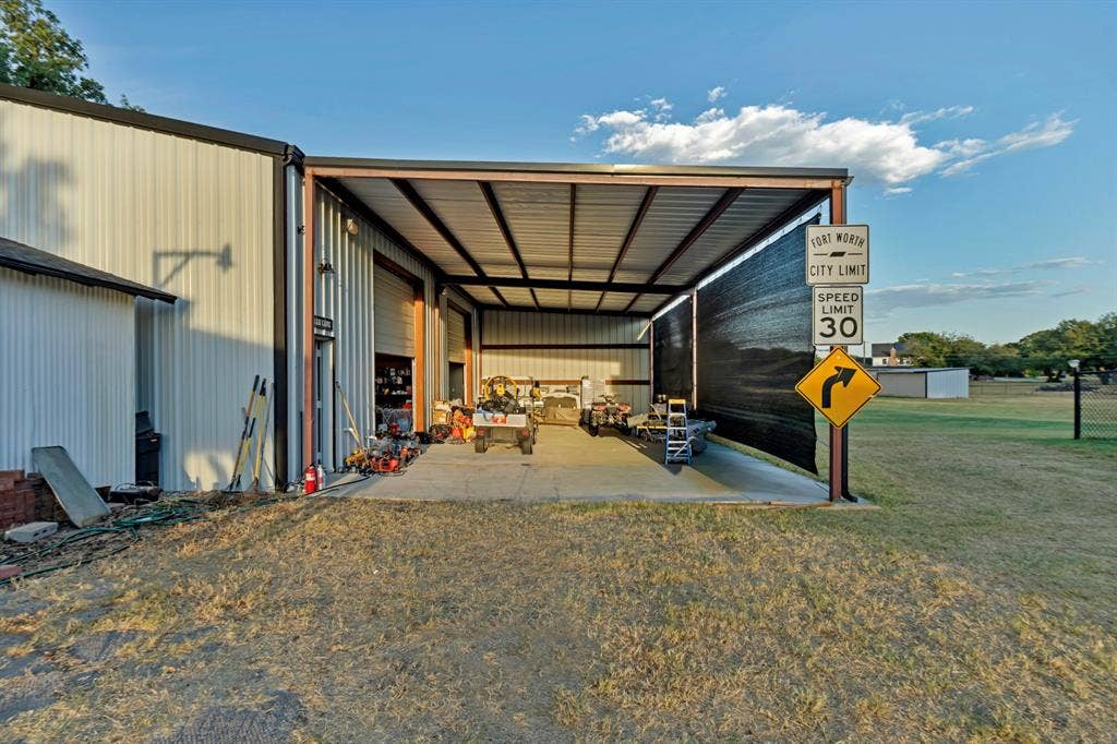 6155 Stephenson Levy Road, Fort Worth, TX 76140 This covered area in front of the shop is 24 feet deep and 50 feet wide. Perfect for RV or boat parking.