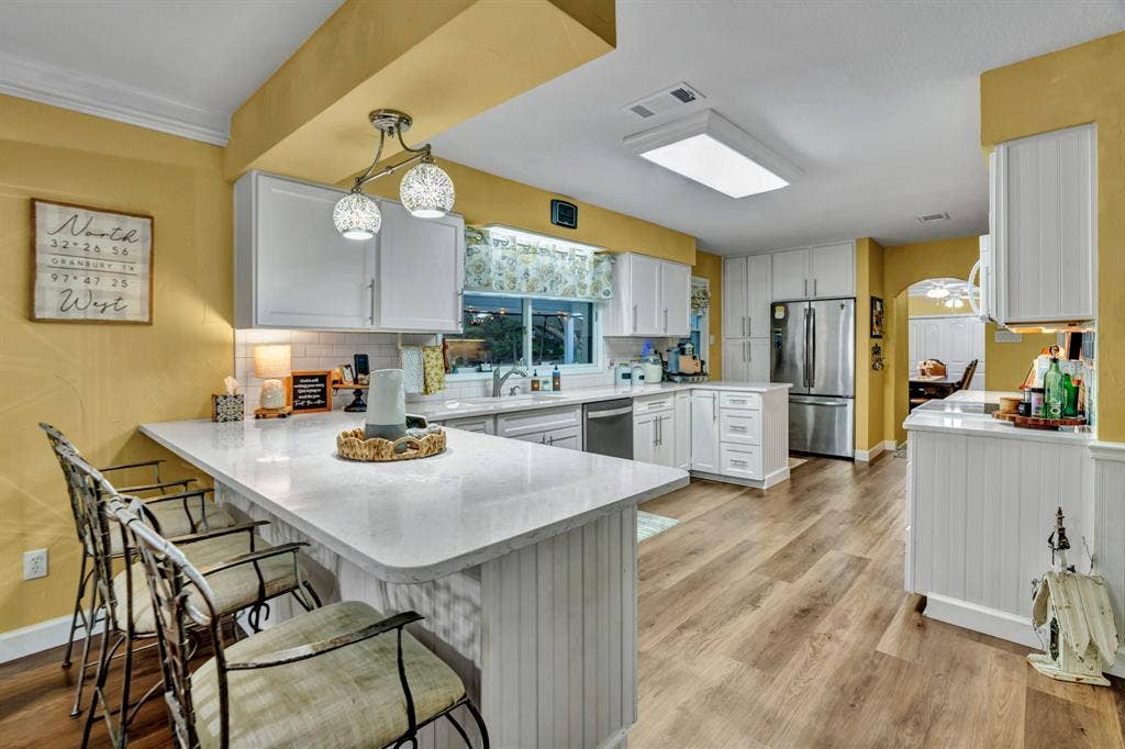 6155 Stephenson Levy Road, Fort Worth, TX 76140 Roomy kitchen looks out over the beautiful pool, large backyard and acreage.