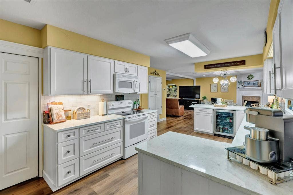 6155 Stephenson Levy Road, Fort Worth, TX 76140 Beautiful Quartz counter tops, in this well laid out kitchen, complete with a beverage fridge and large pantry