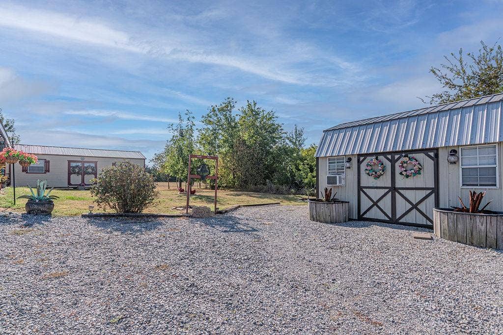 4129 County Road 4111, Campbell, TX 75422 Two of the three sheds with electric, heat, and air conditioning