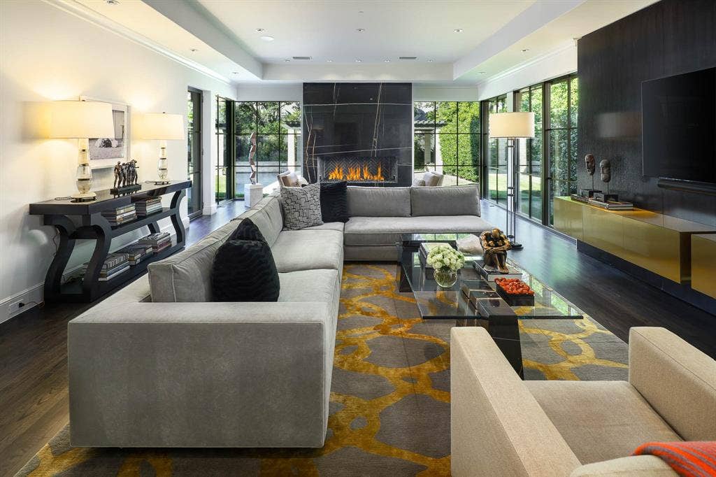 6039 Waggoner Drive, Dallas, TX 75230 Family Room with gas fireplace with floor to ceiling windows overlooking private backyard