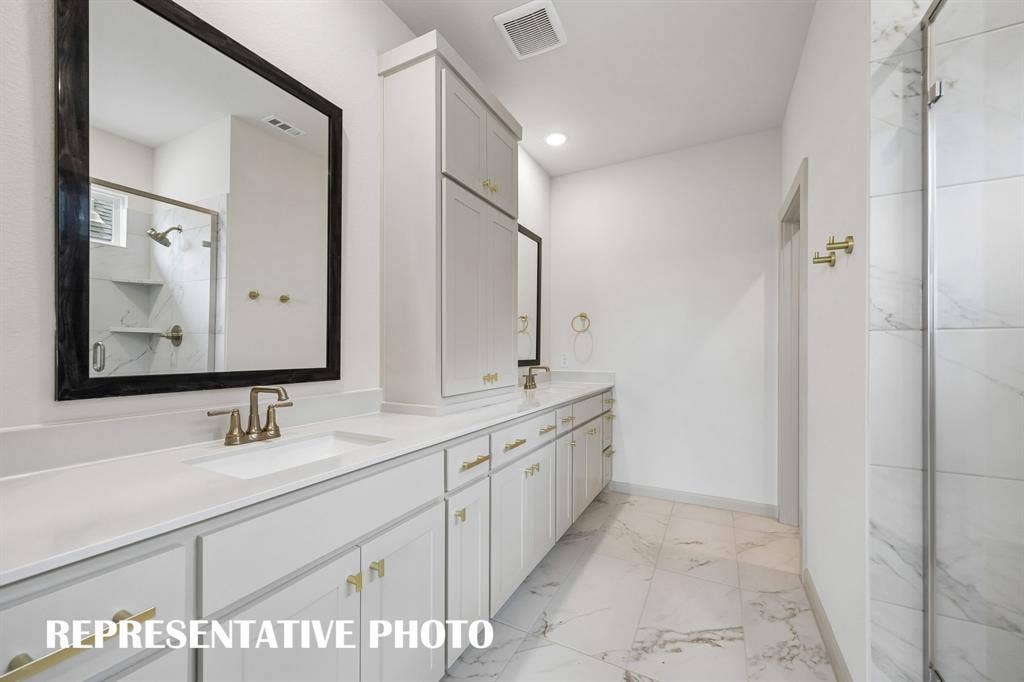 4608 Reveille Drive, McKinney, TX 75071 Featuring fantastic storage and dual vanities, this owner's bath offers ample room for two! REPRESENTATIVE PHOTO