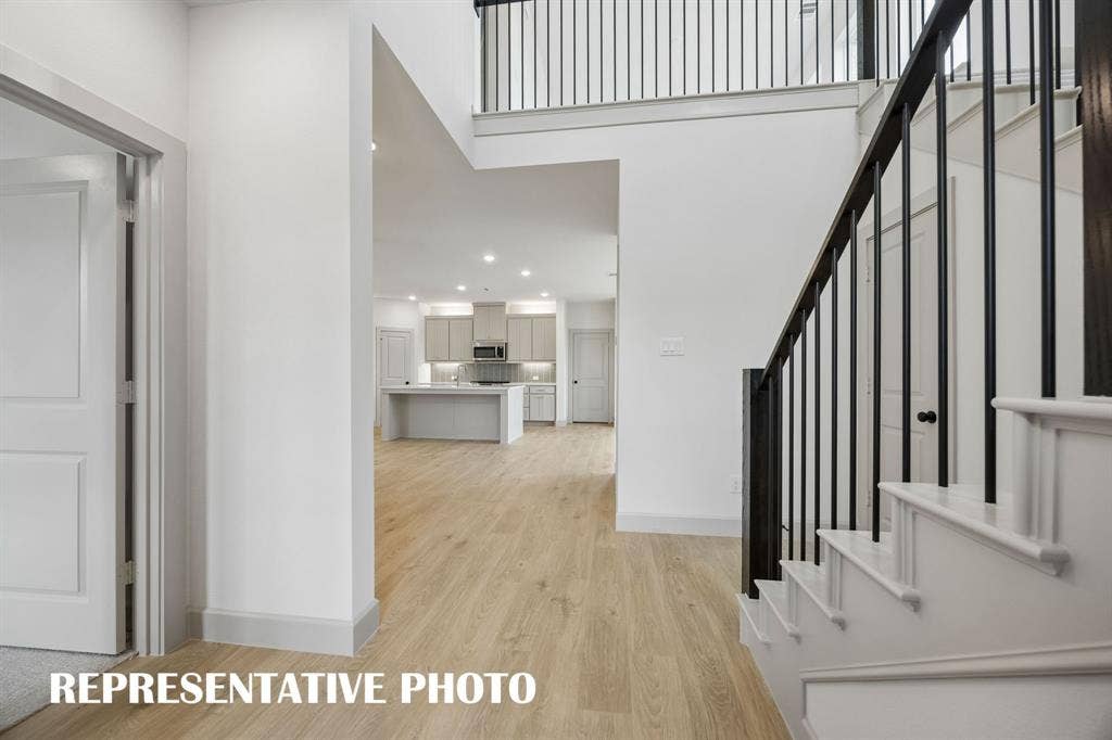 4608 Reveille Drive, McKinney, TX 75071 Welcome into your beautiful new dream home featuring light wood-look flooring, elegant stair railings and open sight lines throughout! REPRESENTATIVE PHOTO