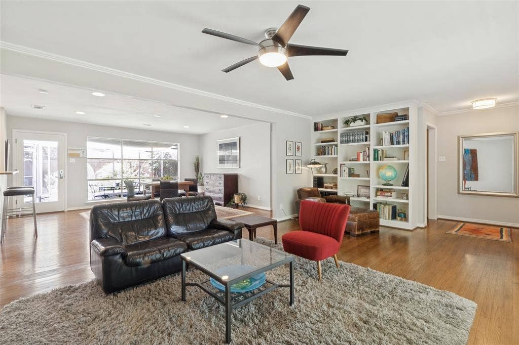 6719 Braeburn Drive, Dallas, TX 75214 Original Hardwood floors throughout, bright recessed lighting, and a contemporary ceiling fan