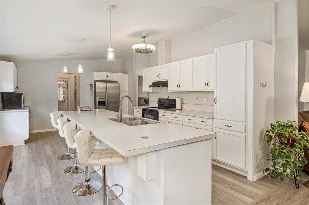 Kitchen with island and bar seating