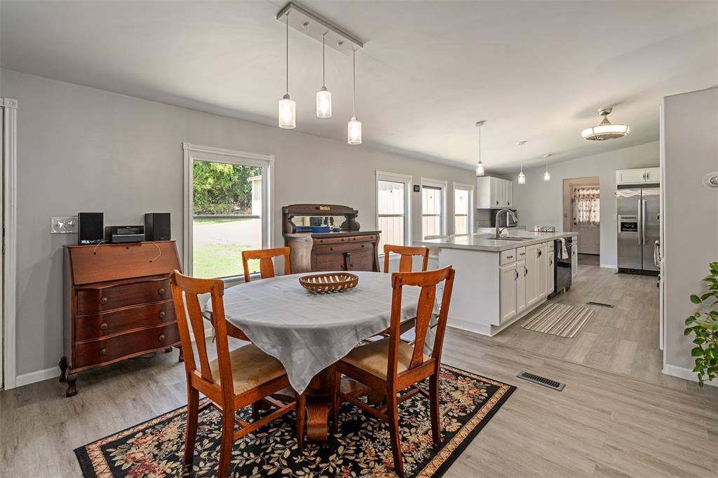 Dining open to kitchen and living room