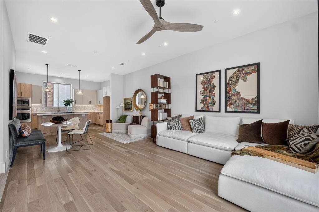 Open-concept living space with Visual Comfort Ceiling Fan