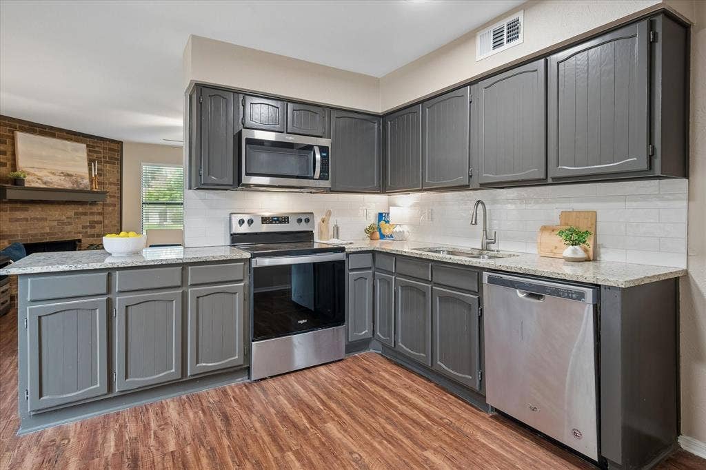 1213 Frio Lane, Garland, TX 75040 Updated countertops and paint on the cabinets.