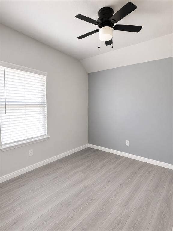 714 N Wofford Street, Athens, TX 75751 Light wood-finish flooring with a neutral color palette, ceiling fan with integrated lighting, and window with horizontal blinds