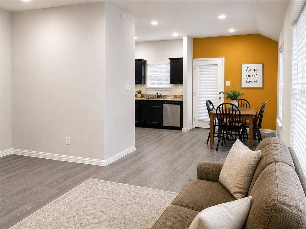 714 N Wofford Street, Athens, TX 75751 Recessed lighting, wood-finish flooring, white window blinds, dark cabinetry, and stainless steel appliances