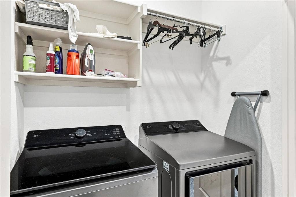 4833 Lunker Street, McKinney, TX 75071 Smart storage makes this laundry area exceptionally functional, with shelving, hanging space, and room to keep everything neatly organized.