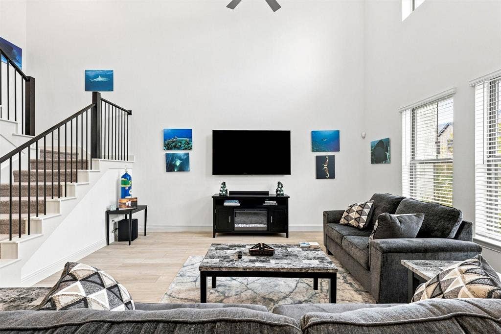 4833 Lunker Street, McKinney, TX 75071 Volume, light, and style come together in this spectacular living space, where towering ceilings create an undeniable sense of grandeur.