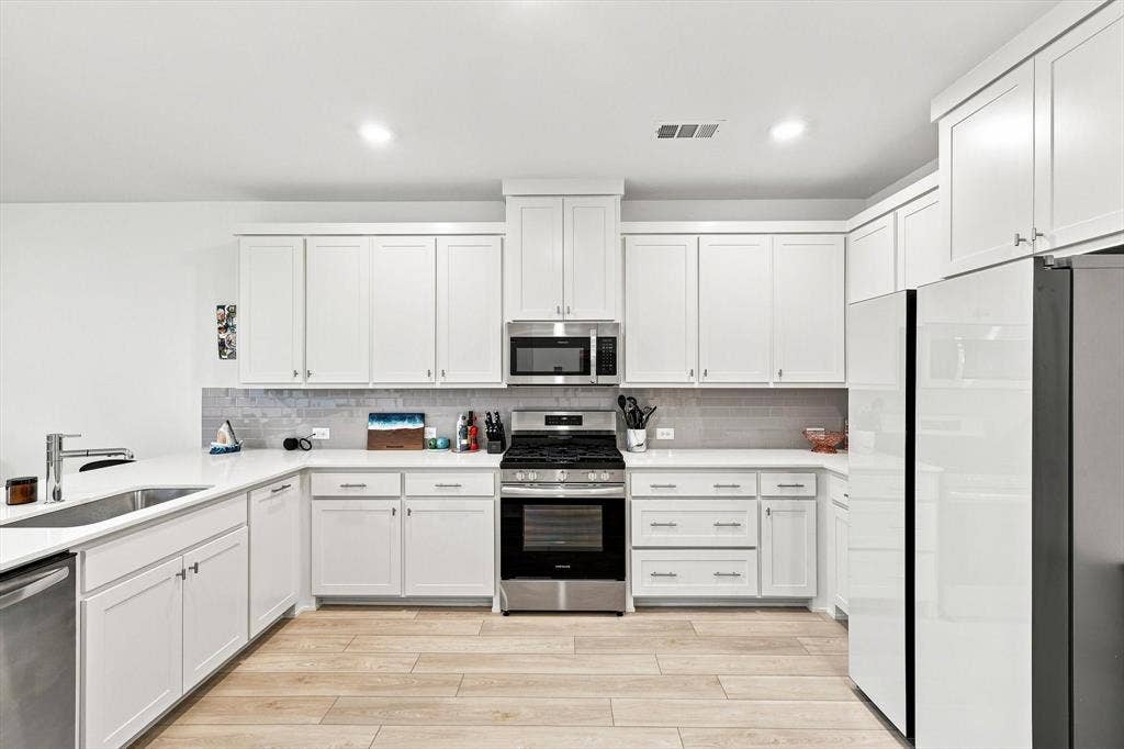 4833 Lunker Street, McKinney, TX 75071 Storage meets style. An impressive wall of cabinetry, abundant counter space, and sleek stainless appliances give this kitchen the clean, elevated look buyers love.