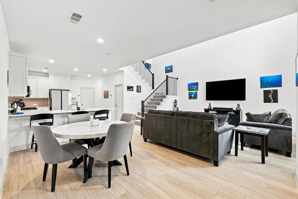 4833 Lunker Street, McKinney, TX 75071 This is the floor plan buyers are looking for. Kitchen, dining, and living spaces come together in one expansive, light-filled setting made for connection.