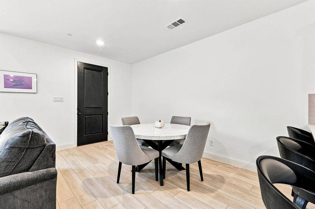 4833 Lunker Street, McKinney, TX 75071 A dedicated dining space offers the perfect setting for morning coffee, intimate dinners, or gathering with friends—all just steps from the kitchen.