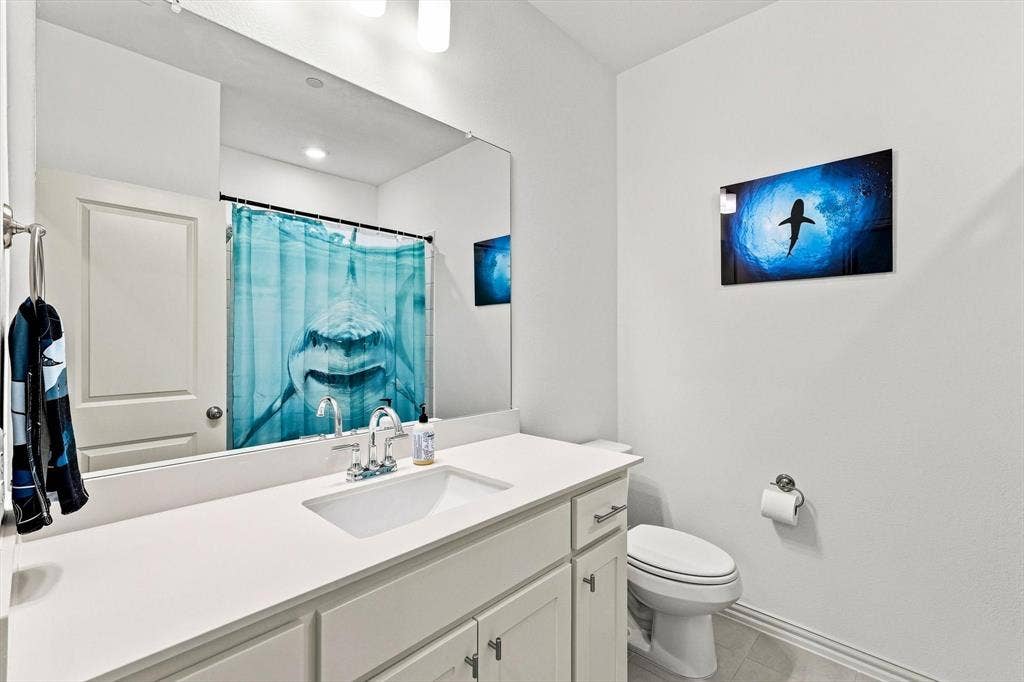 4833 Lunker Street, McKinney, TX 75071 Fresh and functional, this full bath features a clean white vanity, generous counter space, and a bright, polished look.