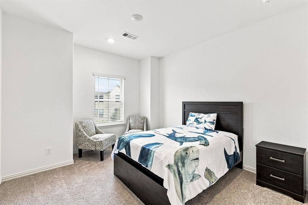 4833 Lunker Street, McKinney, TX 75071 Bright, spacious, and inviting, this secondary bedroom offers plenty of room to unwind, recharge, or create a personalized retreat.