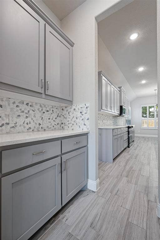 6001 Allison Drive, Midlothian, TX 76065 The Butlers pantry is located across from the walk-in pantry. It is well located between the kitchen and the formal dining room.
