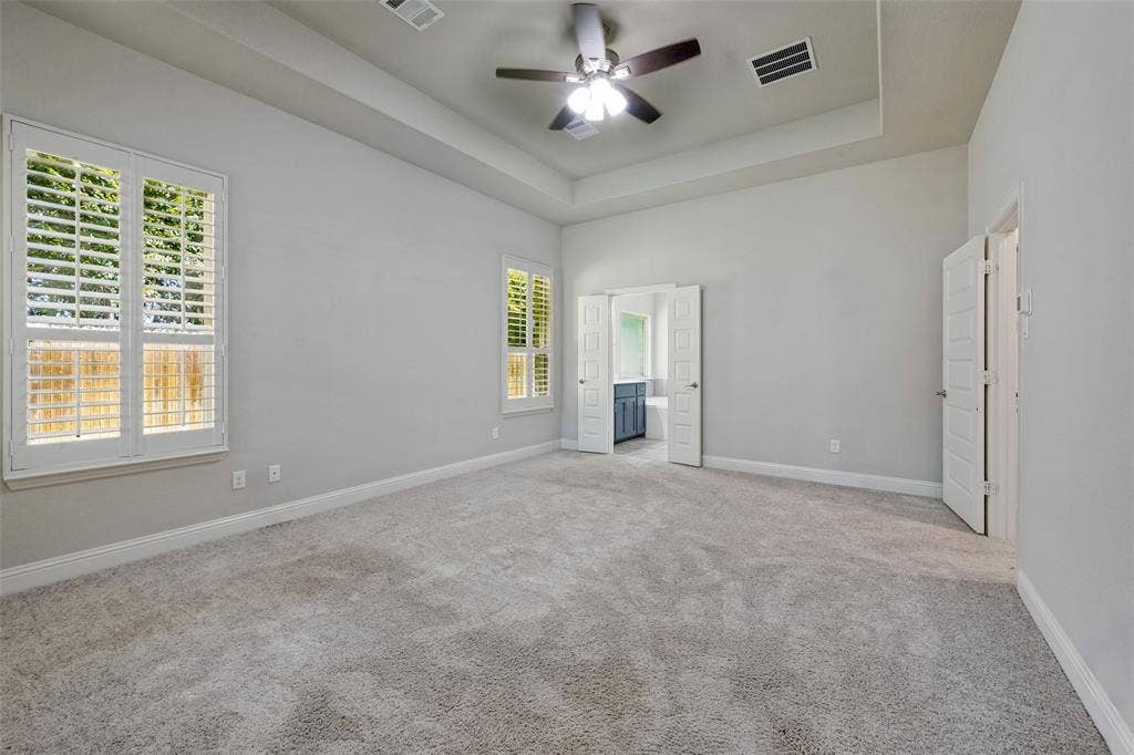 6001 Allison Drive, Midlothian, TX 76065 The primary bedroom features an ensuite bath and large walk-in closet.