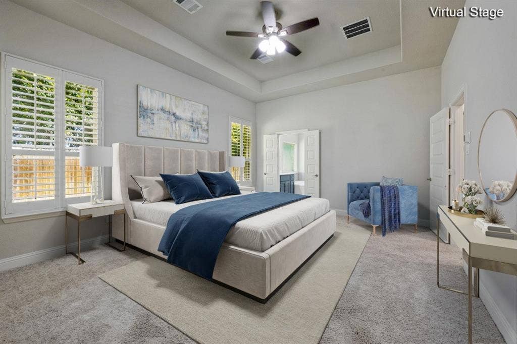 6001 Allison Drive, Midlothian, TX 76065 Virtually staged primary bedroom. There is built in wiring for a TV on the wall above the blue chair.