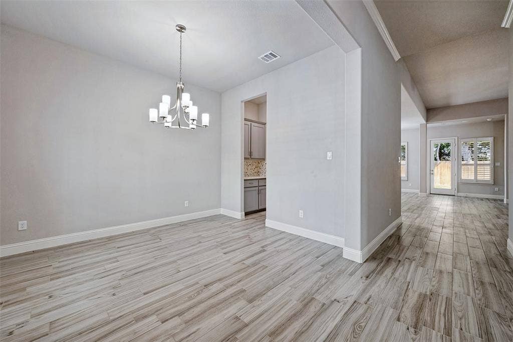 6001 Allison Drive, Midlothian, TX 76065 Here is another look at the formal dining room which also shows you the adjoining Butlers Pantry. This picture also shows the entry hallway going to the living area.