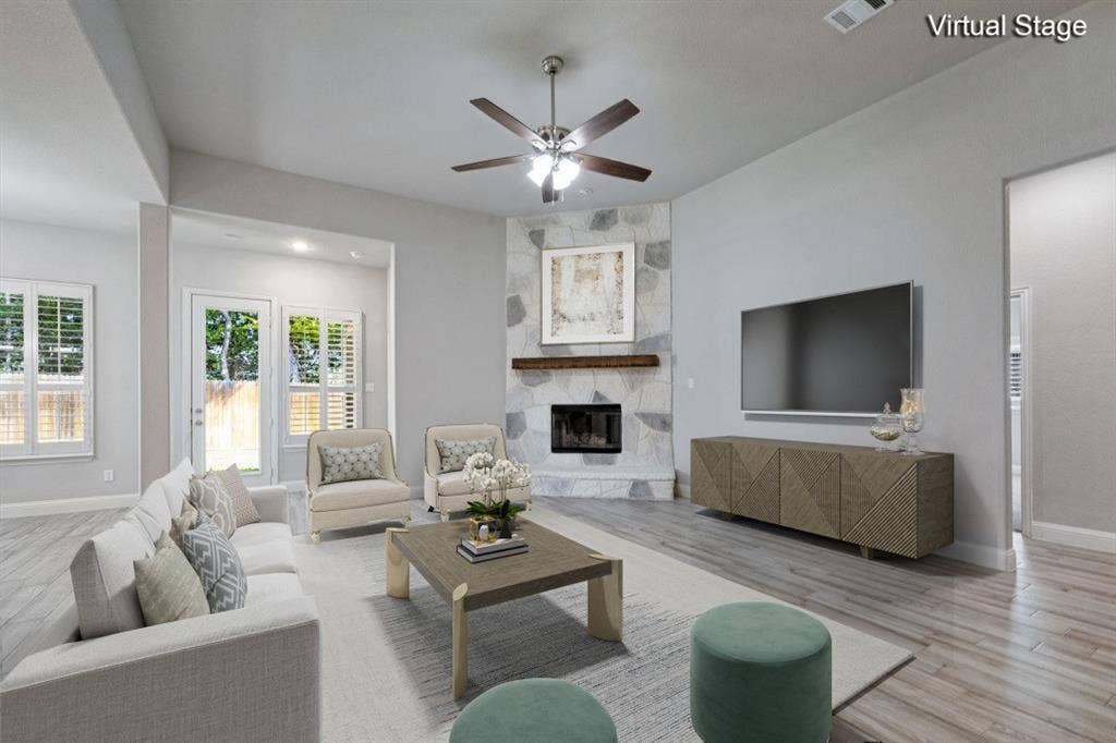 6001 Allison Drive, Midlothian, TX 76065 Virtually staged living area. There is wiring for a TV on the wall where the TV is seen in this picture.