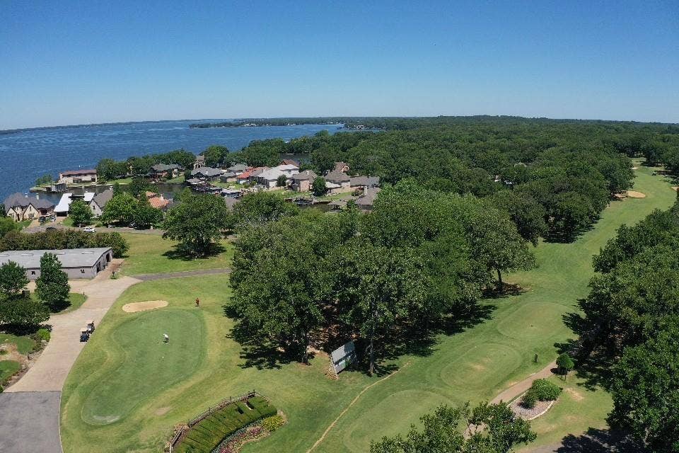 128 Saint Andrews Drive E, Mabank, TX 75156 Waterfront community offering golf course access and mature trees