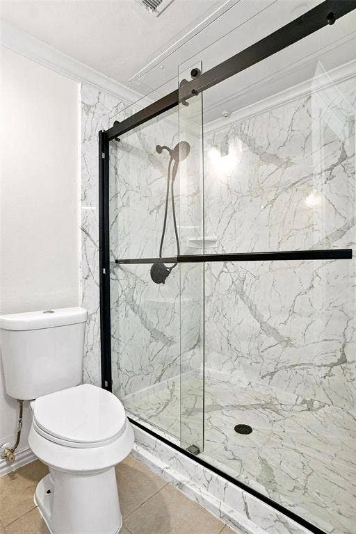 2601 Preston Road, #4103, Plano, TX 75093 Shower enclosure with clear glass and matte black hardware, featuring marble-finish wall and floor tiling