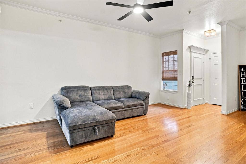 2601 Preston Road, #4103, Plano, TX 75093 Wood-finish flooring, crown molding, and a ceiling fan with integrated lighting