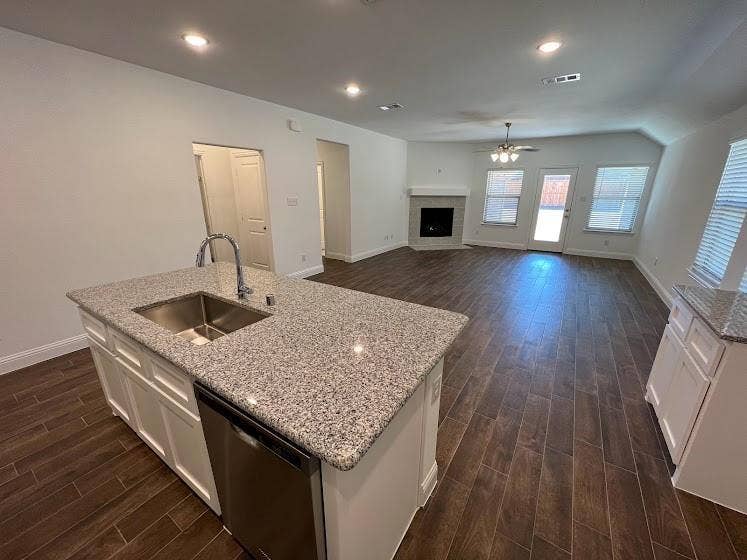 1408 Rendyn Street, Anna, TX 75409 Kitchen island with a stainless steel sink, gooseneck faucet, and integrated dishwasher