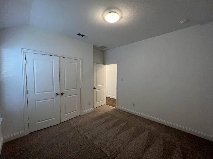 1408 Rendyn Street, Anna, TX 75409 Neutral-toned carpeting, white walls, and white trim
