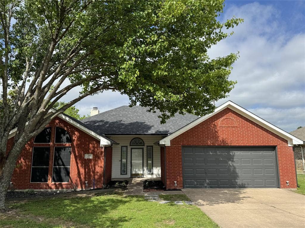 1025 Boardwalk Street, Midlothian, TX 76065 View of front of home featuring a garage and a front yard