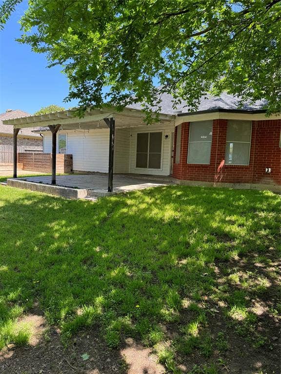 1025 Boardwalk Street, Midlothian, TX 76065 Ranch-style house featuring a pergola, a patio, and a front lawn