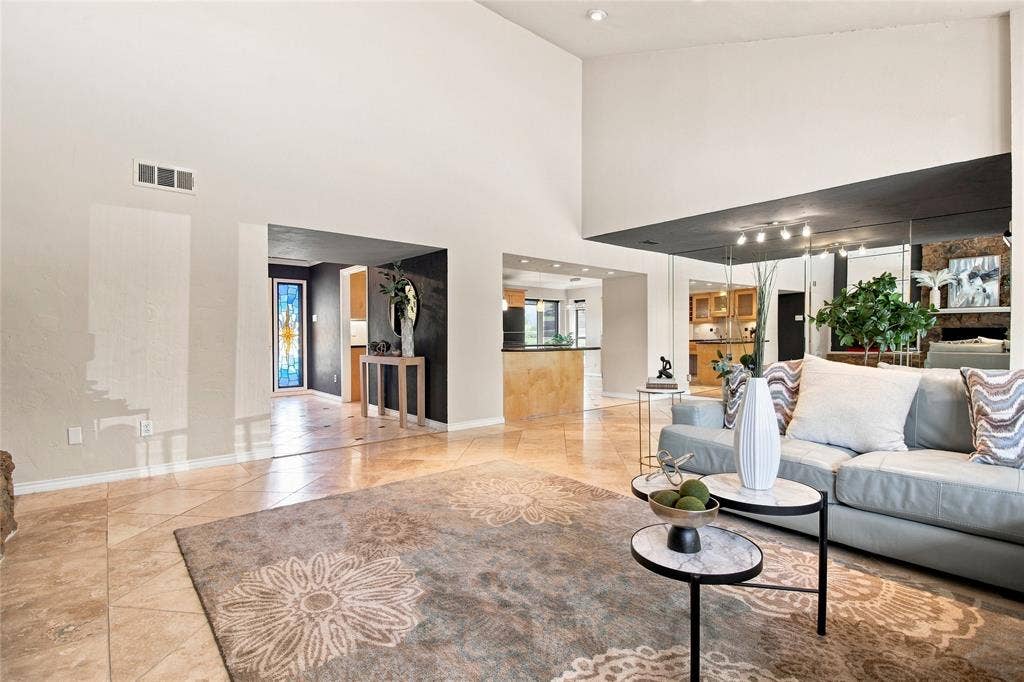 1417 Sun Valley Drive, Garland, TX 75043 Vaulted ceiling, recessed lighting, tile flooring, mirrored wall, and open archways