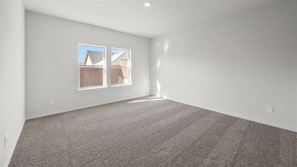 5033 Shumard Drive, Lindale, TX 75771 Recessed ceiling lighting, two windows, wall-to-wall carpeting, and white wall finishes