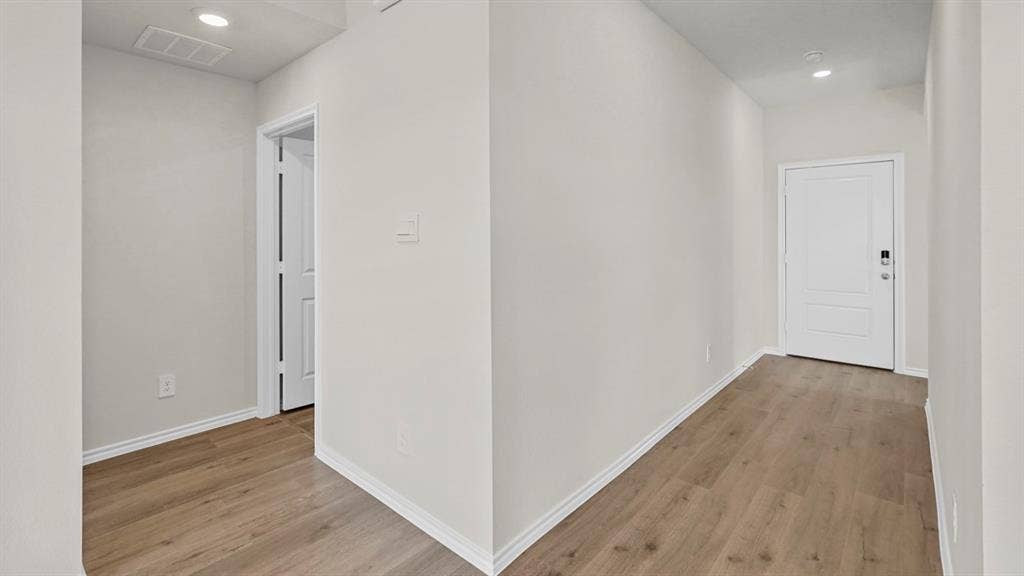 219 Yates Street, Bullard, TX 75757 Wood-finish flooring, recessed lighting, and white trim