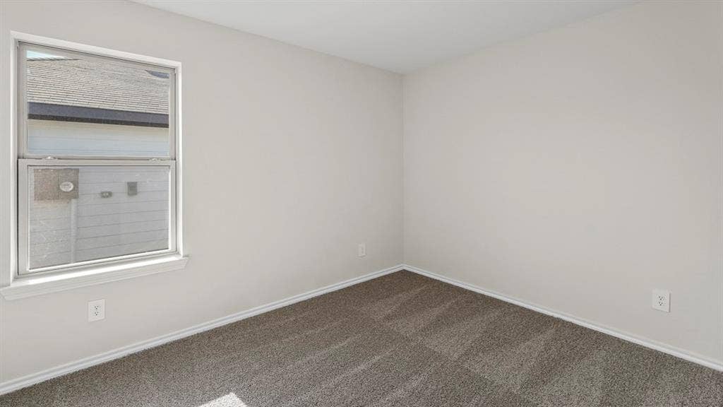 219 Yates Street, Bullard, TX 75757 Carpeted flooring, white trim, and a window with white casing