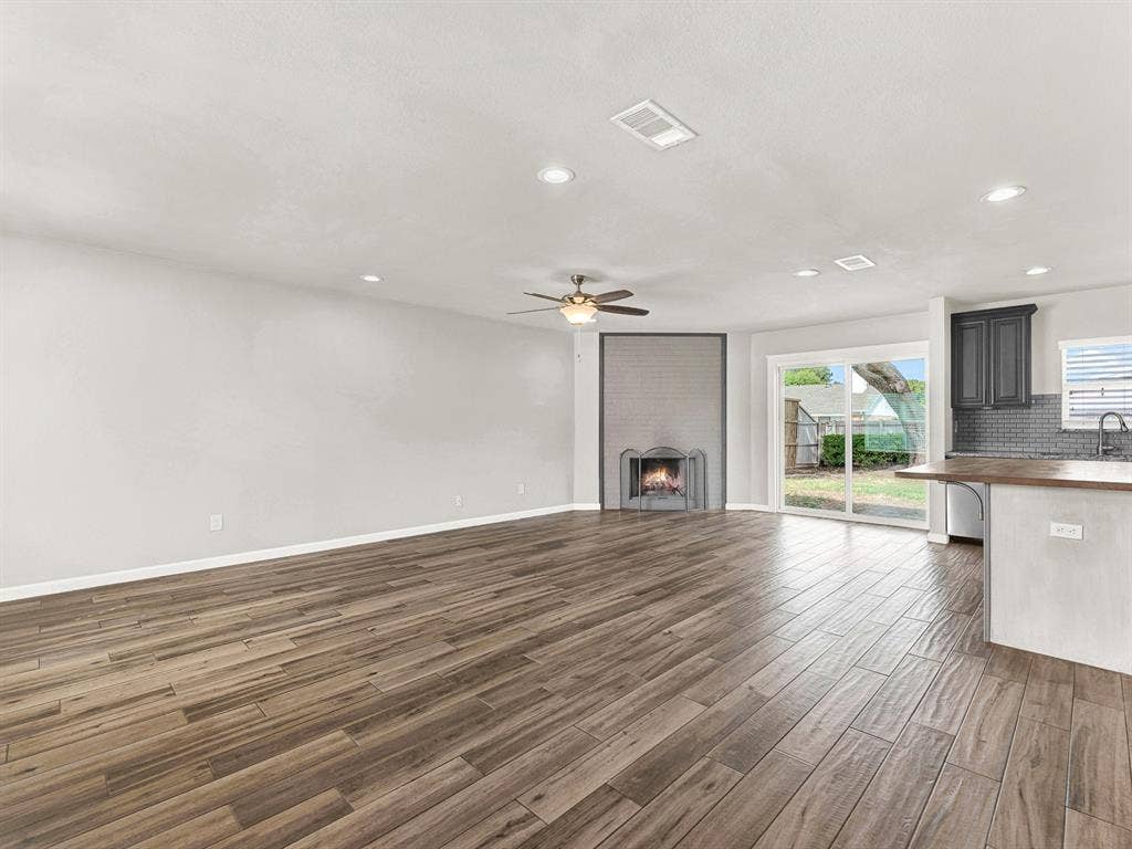 Open concept living at it's best- living room, kitchen, breakfast bar, and dining area