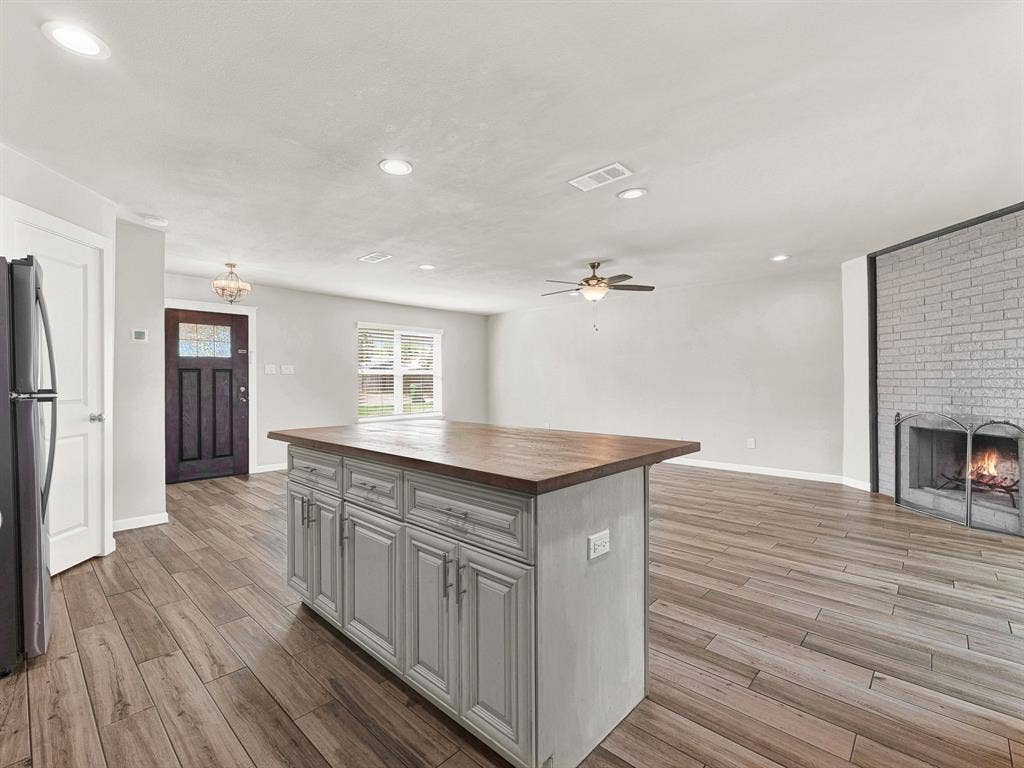 View from the kitchen sink into the open living spaces