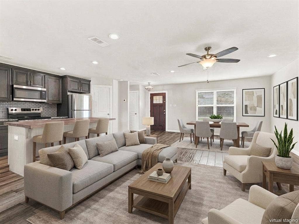 Open concept living at it's best- living room, kitchen, breakfast bar, and dining area