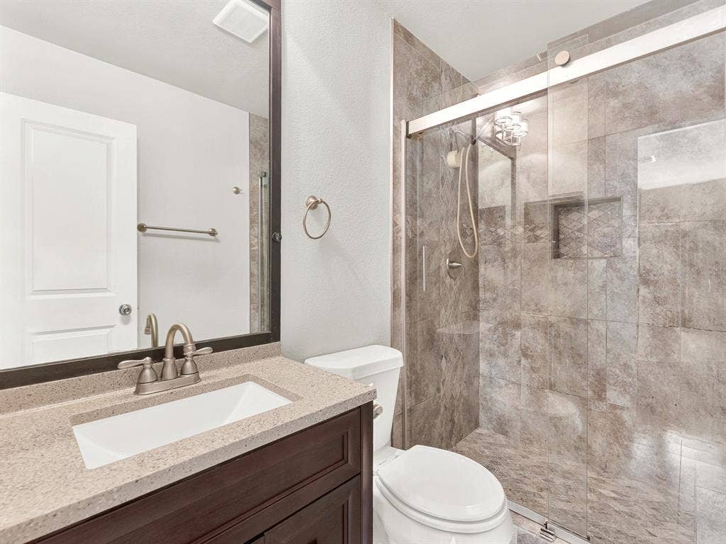 Ensuite primary bathroom with updated walk-in shower