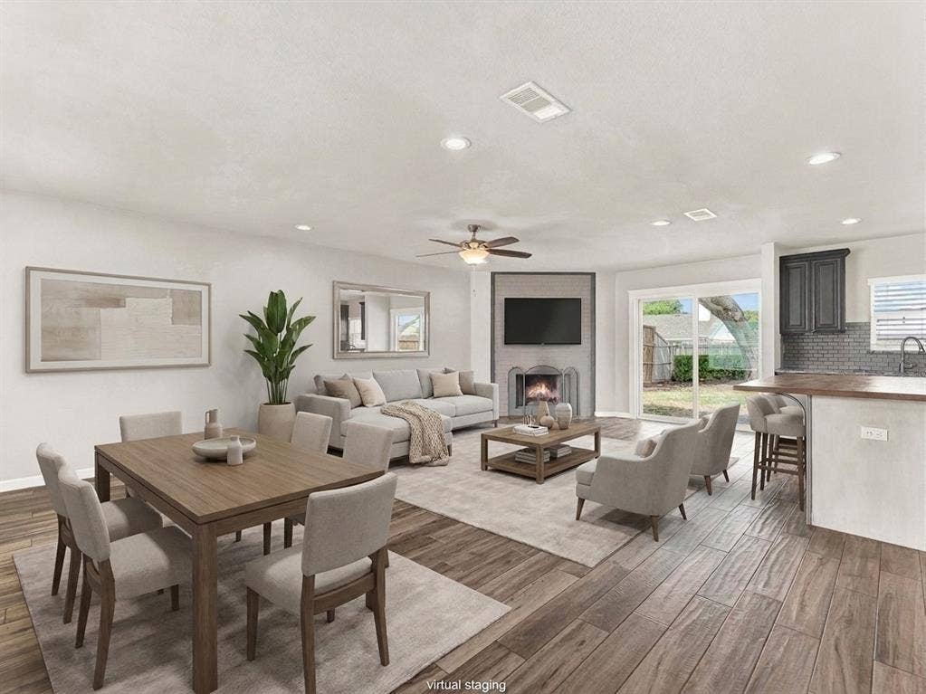 Open concept living at it's best- living room, kitchen, breakfast bar, and dining area